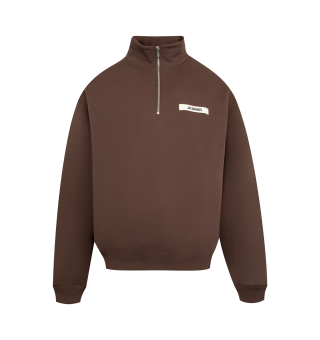 Image 1 of 2 - BROWN - JACQUEMUS Gros Grain Zipped-Rollneck Sweatshirt featuring relaxed fit, cotton fleece, zipped stand collar, long sleeves, ribbed cuffs and hem and grosgrain logo on chest. 100% cotton. Made in Portugal.