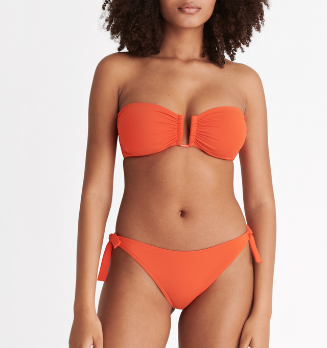 Image 4 of 6 - ORANGE - ERES Show Bandeau Bikini Top featuring bust shirring at front and sides, U-shaped metal link between cups, side stays and branded large back clasp. 84% Polyamid, 16% Spandex. Made in Italy. 