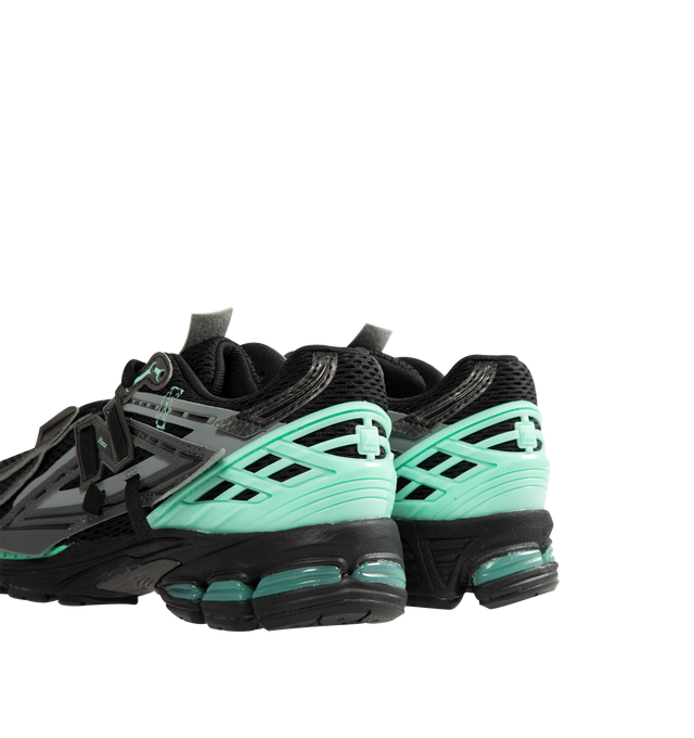Image 3 of 5 - BLACK - New Balance Unisex 1906A "Tech Explosion / Black Bright Mint" Sneakers feature a performance-inspired silhouette rooted in early-2000s running design and equipped with advanced cushioning technologies for all-day comfort. Built with a breathable mesh upper, mesh underlays, and curvilinear synthetic overlays, this updated style combines technical heritage with a modern aesthetic. The sole unit pairs ACTEVA LITE cushioning, ABZORB SBS heel pods, and an N-ergy outsole for responsive co