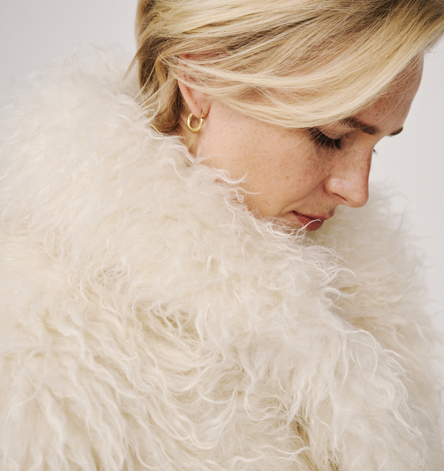Image 4 of 4 - CREAM - Moncler Grenoble Women's Malencos Padded Short Jacket is crafted from plush faux fur and features a sophisticated peacoat-inspired silhouette with oversized lapels and lightweight padding for warmth. Inspired by the brand's mountaineering heritage, this textured outerwear style blends elevated alpine design with everyday comfort. Finished with a snap-button front closure, side pockets, an interior media pocket with a YKK AquaGuard NATULON water-repellent zipper, and stretch jersey wri