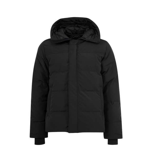 Image 1 of 3 - BLACK - CANADA GOOSE MacMillan Parka featuring adjustable down-filled Snorkel hood, hood features a removable zipper guard for the option of changing your hood trim for a customized look and added protection, chin guard is lined with tricot fabric, sleek interior hanging lining with backpack straps, placket with snap closures over 2-way zipper, storm flap underneath 2-way zipper, sleeve cuffs reinforced with CORDURA fabric, sip-length, cut longer in the back, 2 exterior fleece lined front poc