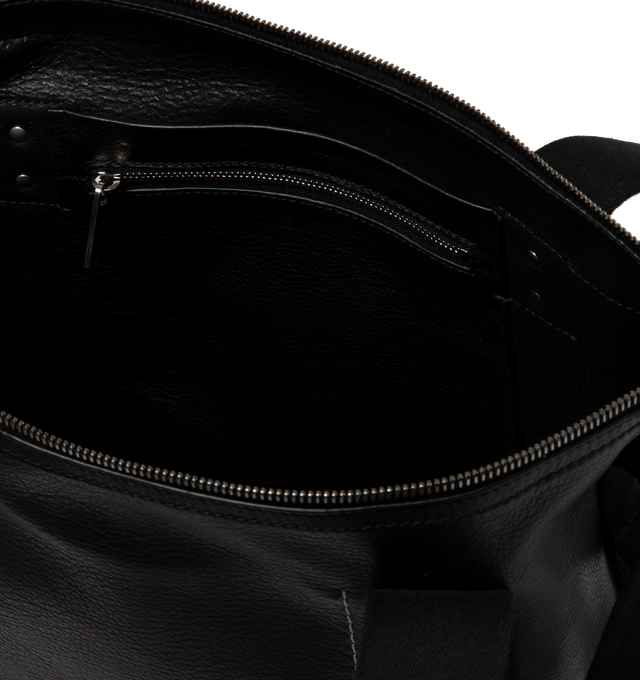 Image 3 of 3 - BLACK - RICK OWENS Mini Trolley Tote featuring twin webbing carry handles, adjustable webbing shoulder strap, carry handle at side, D-ring hardware and embossed logo at face, zip closure, patch pockets and zip pocket interior, unlined and logo-engraved silver-tone hardware. H12 x W10 x D4.5 in. Leather, textile. Made in Italy. 