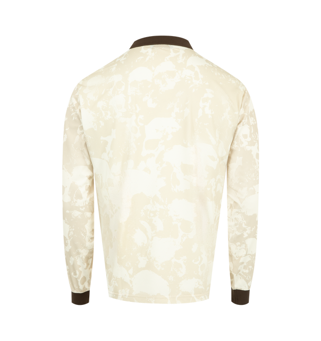 Image 2 of 3 - BROWN - PLEASURES Despair Long Sleeve Jersey featuring a polyester-spandex blend, all-over skull print, Johnny collar, ribbed trims, contrast details, screen-printed branding and regular fit. 94% polyester, 6% spandex.