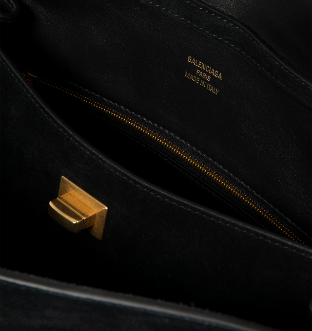 Image 4 of 4 - BLACK - Balenciaga Rodeo Handbag Medium is crafted from suede calfskin and smooth calfskin leather and features a structured yet relaxed silhouette with a top handle and removable shoulder strap. Designed with a turn-lock closure, aged-gold hardware, a removable cloche cls, a wide front pocket, and multiple interior compartments, the bag offers versatile carry options and everyday functionality. Main Material: Calfskin Leather. Lining: Nappa Lambskin. Made in Italy.
