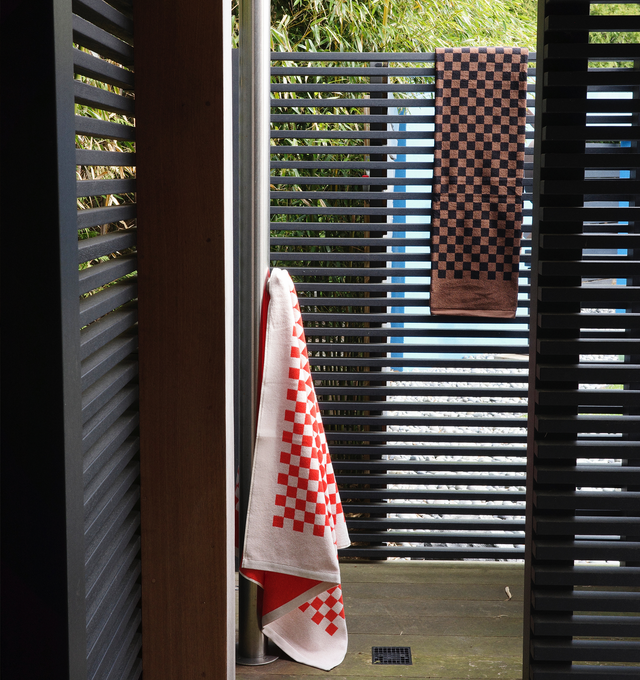Image 6 of 6 - BROWN - BAINA x 1910 Heritage Beach Towel Set includes 4 Beach Towels (35 x 67 inches). 100% Organic Cotton. Referencing the legacy of Hirshleifers with deep tones of Tabac & Noir, giving a feeling of retro luxe, evoking a destination off the Italian coast, circa 1972. Generous in size and luxuriously soft, they create an enveloping embrace.  