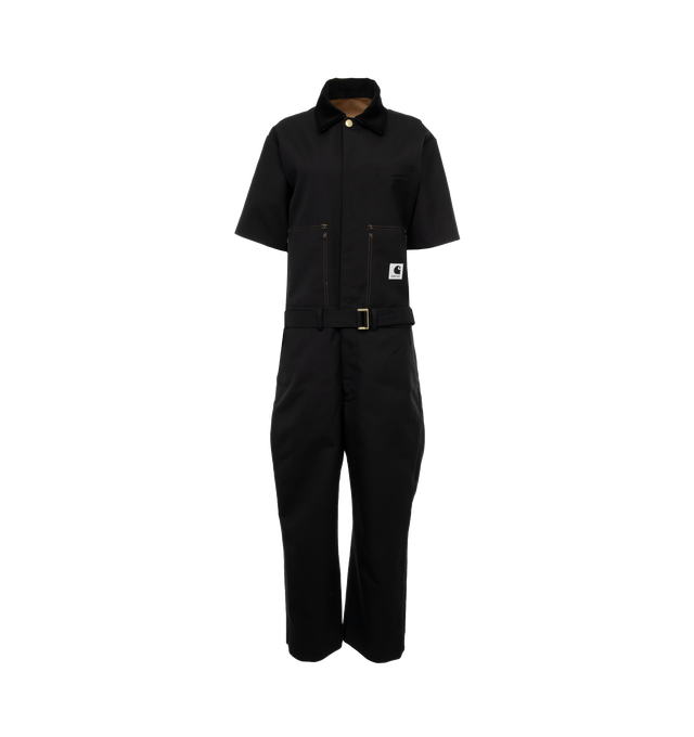 Image 1 of 5 - BLACK - SACAI X CARHARTT WIP Suiting Bonding Jumpsuit is a hybrid of Carhartt WIPs Bib Overall, and sacais short-sleeve suit shirt and trousers. The item is constructed from two bonded layers of fabric and can be worn inside-out. On the surface is sacais wool-blend suiting fabric and on the reverse is Carhartt WIPs duck canvas. A chest pocket belonging to sacais short-sleeve suit shirt appears on the outside, with stitched details appearing on the reverse. The surface also features sacais sui 