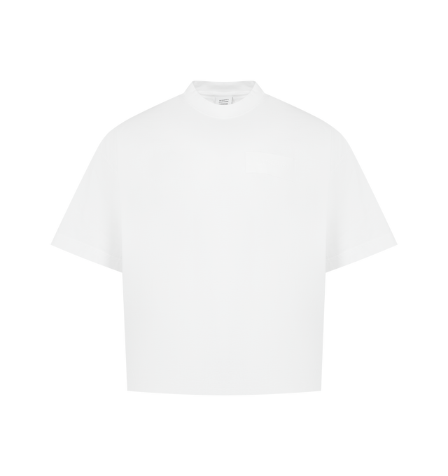 Image 1 of 2 - WHITE - VETEMENTS Taped Logo T-shirt featuring cotton jerse, embroidered logo with tape appliqu at chest and back collar, rib-knit crewneck and dropped shoulders. 100% cotton. Made in Portugal.
