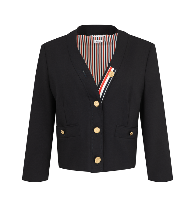 Image 1 of 3 - NAVY - Thom Browne Women's Hopsack Suiting Cardigan Jacket is crafted from open-weave virgin wool hopsack suiting and reinterprets classic tailoring through a relaxed, cardigan-inspired silhouette. Designed with a V-neckline, the jacket features an anchor-detailed button closure with a signature RWB grosgrain placket, buttoned welt hand pockets, and two interior pockets. Buttoned cuffs reveal internal RWB grosgrain trim, while a tricolor silk lining and Thom Browne's signature striped grosgra