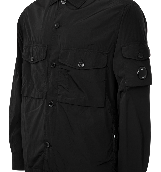 Image 3 of 3 - BLACK - C.P. COMPANY Chrome R Overshirt featuring classic collar, full button fastening, patch front button pockets, side flap snap pockets, lens detail, adjustable button cuffs and regular fit. 100% polyamide/nylon.