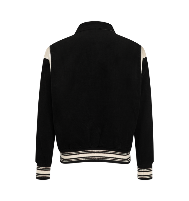 Image 2 of 3 - BLACK - SAINT Mxxxxxx Men's Corduroy Varsity Jacket is crafted from cotton corduroy and features a classic varsity-inspired silhouette with a pointed collar, snap-button front closure, and contrast shoulder panels. Designed with welt pockets, striped rib-knit cuffs and hem, and vintage collegiate influences, this statement jacket blends heritage sportswear styling with SAINT Mxxxxxx's contemporary streetwear aesthetic. Main Material: Cotton Corduroy. Made in Japan.