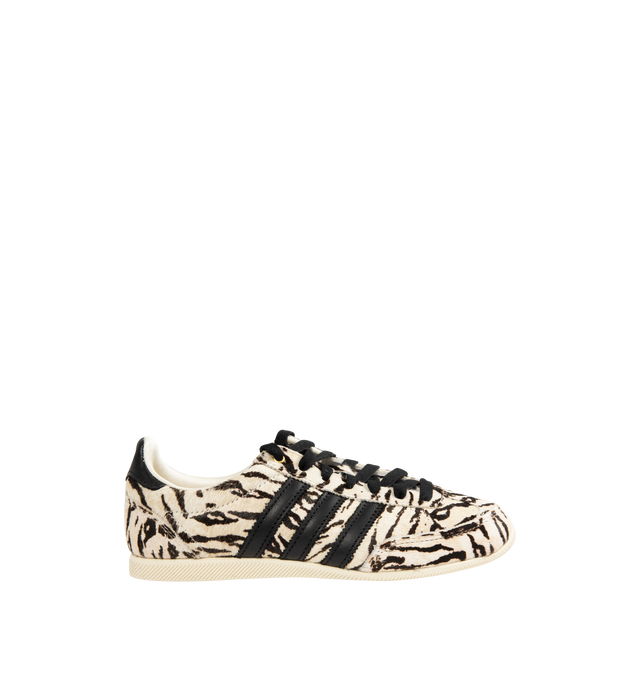 Image 1 of 5 - WHITE - ADIDAS Japan Zebra Pony Hair Sneaker featuring double-stitched T-toe, pony hair finish, iconic 3-Stripes branding, lateral box logo, regular fit, laces, leather upper, textile sockliner and rubber outsole.