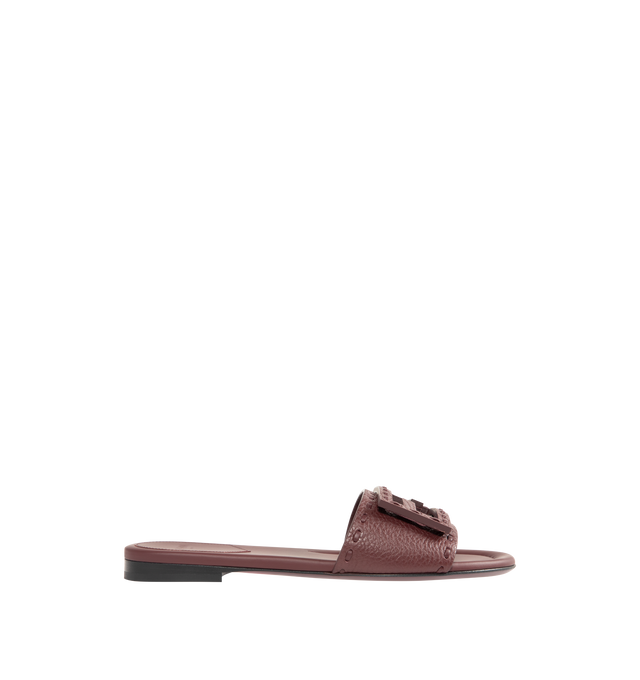 Image 1 of 4 - BROWN - FENDI Baguette Slide featuring wide-band, tumbled leather and embellished with hand-sewn tone-on-tone macro Selleria stitching, an emblem of the iconic Selleria workmanship and tone-on-tone FF Baguette motif. 100% calfskin. Inside: 100% calfskin. Made in Italy.