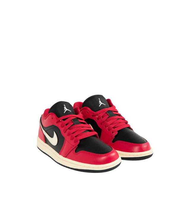 Image 2 of 5 - RED - JORDAN Air Jordan 1 Low Sneaker featuring a high-end mix of leather and synthetic materials in the upper, Air unit encapsulated in the heel, Wings logo on the heel, Jumpman design on the tongue, stitched Swoosh design, perforated toe, foam midsole and rubber traction.