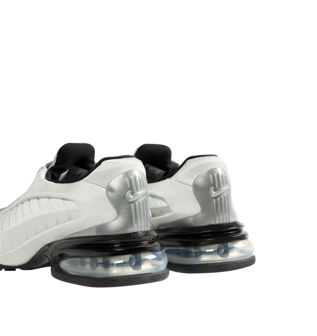 Image 3 of 5 - SILVER - Nike Women's Air Max Dolce features a laceless molded upper with an overlay cage and the signature Air Max silhouette. This streamlined design is detailed with visible Air cushioning in the heel for comfort and a distinctive profile. Designed as a versatile slip-on style. Upper: 70% Calf Leather, 15% Patent Calf Leather, 15% Fabric. Lining: 100% Fabric. Sole: 100% Rubber.