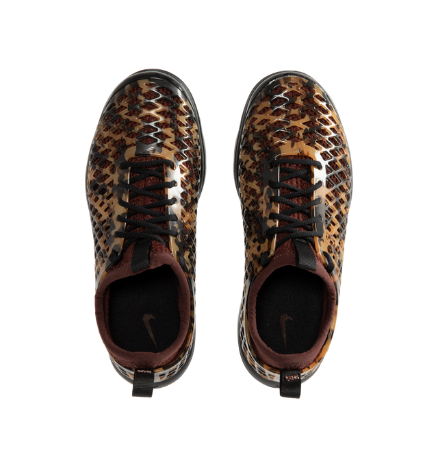 Image 5 of 6 - BROWN - Nike Women's Rejuven8 Run Sneakers feature a black and brown tortoise shell-patterned synthetic upper with a removable mesh bootie and lightly padded collar. Flat laces, heel and tongue pull tabs, a mini Swoosh at the back heel, and Swoosh branding on the sole unit complete the design. ReactX foam provides responsive cushioning, while a rubber outsole offers durable traction. Upper: Synthetic. Bootie: Mesh. Midsole: ReactX Foam. Sole: Rubber.