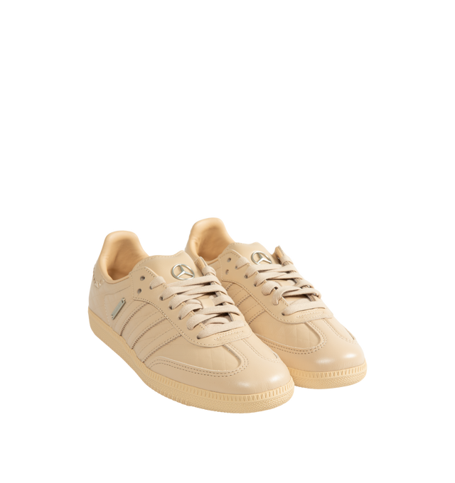 Image 2 of 5 - NEUTRAL - Adidas Men's Samba OG Mercedes-Benz Shoes are crafted from premium leather and feature the iconic Samba silhouette with signature Mercedes-Benz branding and serrated 3-Stripes. Designed with a smooth leather lining for enhanced comfort and a durable rubber outsole for everyday traction, this collaborative style blends heritage sport design with automotive-inspired detailing. Main Material: Premium Leather. Lining: Leather. Outsole: Rubber.