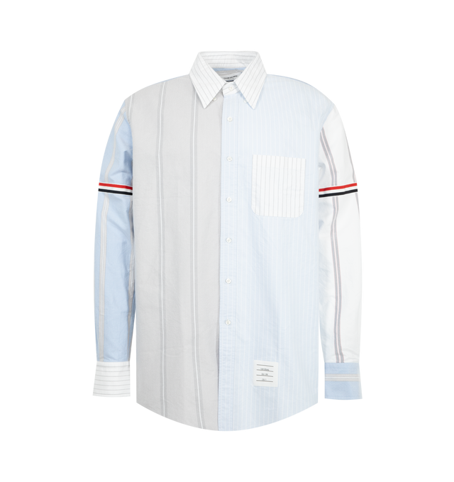 Image 1 of 2 - BLUE - Thom Browne Mens Funmix Straight Fit Button-Down Shirt is crafted from pinstripe Oxford cotton and features a straight-fit silhouette, button-down collar, front button closure, chest patch pocket, signature grosgrain armband, name tag appliqu, pleated back yoke with locker loop, and the signature striped grosgrain loop tab. This designer button-down Oxford shirt combines mixed-pattern detailing with classic tailoring for elevated everyday wear. Main Material: 100% Cotton. Made in Italy