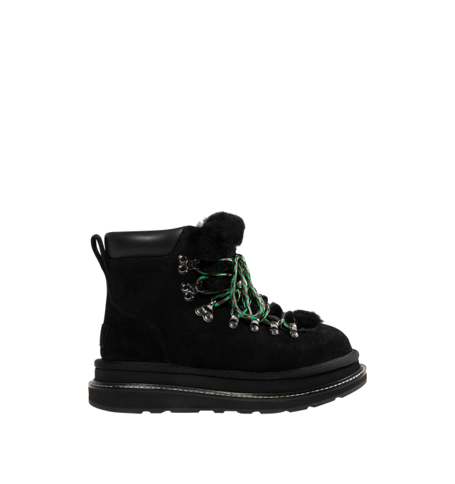 Image 1 of 4 - BLACK - UGG x sacai hiker boots designed for everyday wear, combines UGG's iconic premium  suede with sacai's unmistakable hybridized aesthetic. Upper is made with suede sourced from certified farms that practice regenerative agriculture upper. Midsole incorporates sugarcane EVA. Features Vibram XS Trek Evo. Unisex style in women's sizes.