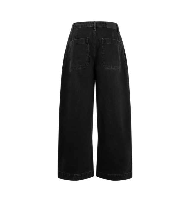 Image 2 of 3 - BLACK - Studio Nicholson Puch Denim Pant is crafted from rigid Italian denim and features a mid-rise, oversized silhouette defined by exaggerated volume and sharp single pleats. Designed with a wide-leg shape, wide cuffs, welt front pockets, U-line back pockets, and a zip-fly with button closure, the pant delivers the brand's signature architectural approach to tailoring. Main Material: 100% Organic Cotton. Made from 13oz Italian Denim.