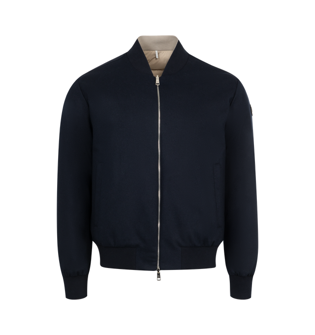 Image 1 of 4 - NAVY - Moncler Villerest Bomber has a baseball collar, a 2-way zip front, side pockets, band-finished cuffs and hem, and a leather logo patch. Down and feather fill. Nylon, polyamide, cashmere, and leather. Made in Romania.