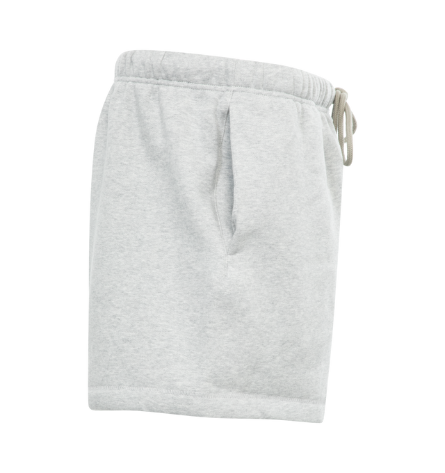 Image 3 of 3 - GREY - FEAR OF GOD ESSENTIALS Running Short featuring cropped length, an encased elastic waistband with elongated drawstrings, side seam pockets and a rubberized label at the center front. 80% cotton, 20% polyester.  