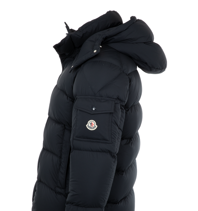 Image 3 of 3 - NAVY - MONCLER Vezere Short Down Jacket featuring recycled longue saison, nylon lger brillant lining, down-filled, detachable and adjustable hood, zipper and snap button closure, zipped pockets, patch pocket on the sleeve, adjustable cuffs and hem with drawstring fastening. 100% polyamide/nylon. Padding: 90% down, 10% feather.