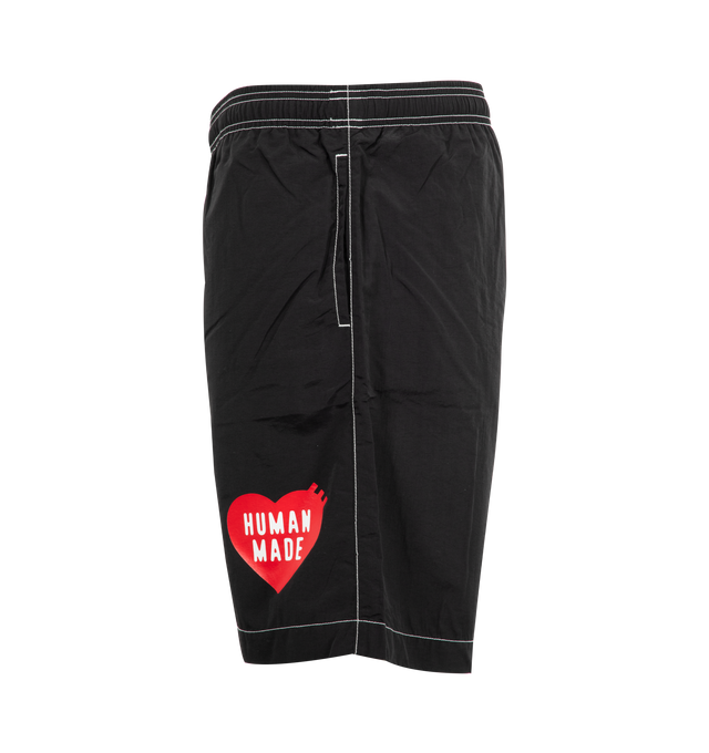 Image 3 of 3 - BLACK - HUMAN MADE Swim Shorts featuring contrast stitching, logo printed at front leg, side pockets, back welt pocket and elastic waist.