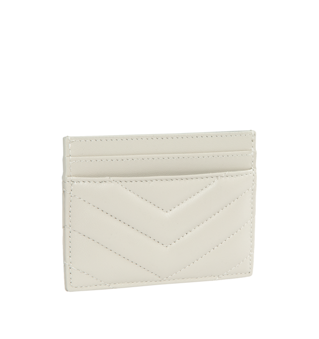Image 2 of 3 - WHITE - SAINT LAURENT Monogram Card Case featuring five card slots, gold tone hardware, cassandre and chevron-quilted overstitching. 4 X 2.8 X 0.1 inches. 100% lambskin. Made in Italy.