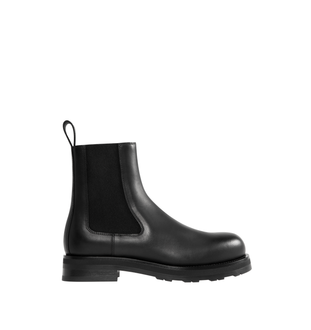 Image 1 of 4 - BLACK - THE ROW Chelsea Lug Sole Boots featuring round toe, pull-on style, branded leather insole, chunky rubber lug sole, ankle-length and elastic side panel. 100% calfskin leather. Sole: 100% rubber. Made in Italy.