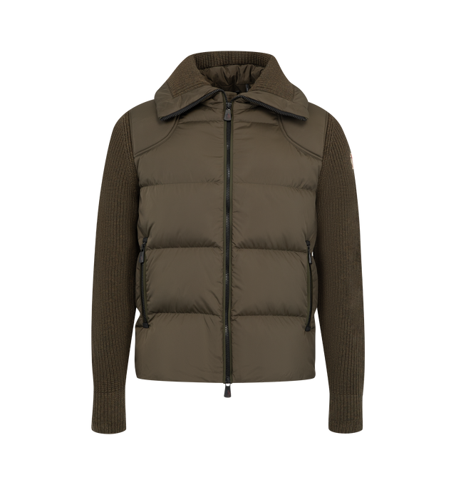 Image 1 of 1 - BROWN - Moncler Men's Padded Wool Zip-Up Cardigan is crafted from virgin wool and features a half-rib knit construction, a down-filled nylon front panel, and a front zip closure. Designed to function as both knitwear and lightweight outerwear, this style is finished with a gauge 5 knit, zipped pockets, and technical rainwear fabric details. Main Material: 100% Virgin Wool. Front Panel: 100% Polyamide/Nylon. Collar: 100% Polyamide/Nylon. Yoke: 100% Polyamide/Nylon. Front Lining: 100% Polyamide