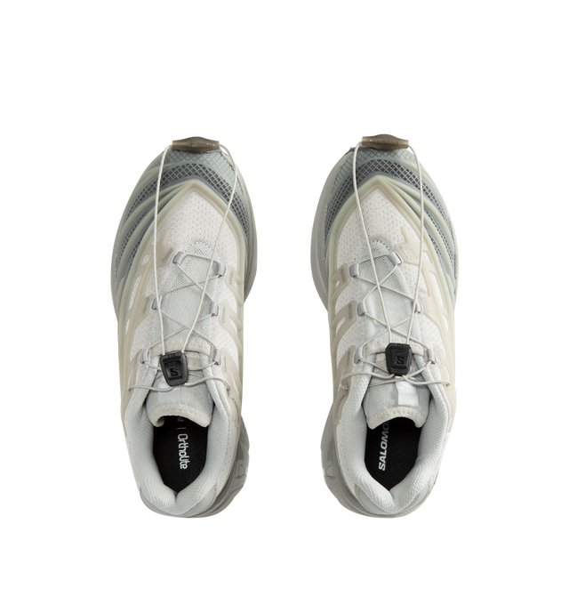 Image 5 of 5 - GREY - Salomon Unisex XT-EVO Sneakers are built with a synthetic and textile upper and are made to be a performance-driven combining stability and cushioning for lasting comfort. Additional details include Quicklace one-pull lacing, endoFit internal sleeve construction, sensiFIT support, seamless construction, and a lace pocket for streamlined wear. A molded OrthoLite sockliner and Mud ContaGRIP rubber outsole enhance cushioning, durability, and traction across varied terrain. Upper: Syntheti