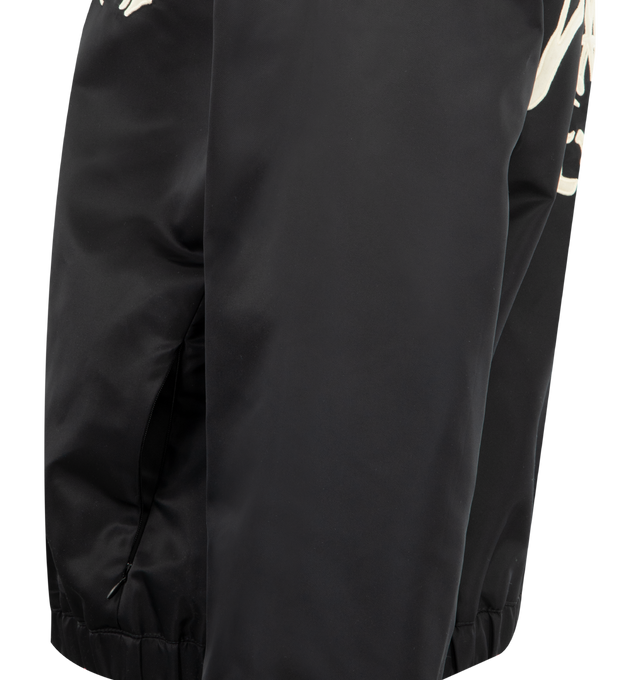 Image 3 of 3 - BLACK - AMIRI Hollywood Jacket featuring nylon twill, stand collar, zip closure, logo appliqu at chest and back, zip seam pockets, elasticized hem and cuffs, text appliqu at back, welt pocket at interior and full satin lining. 100% polyamide. Made in Italy.