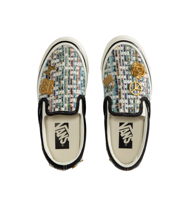 Image 5 of 5 - BLACK - Vans iconic slip-on shoe crafted from midweight canvas adorned with metal pins with rhinestones and crystal studding. Elevated design featuring higher sidewalls with gloss finish, enhanced cushioning and padded collar for support and all-day comfort. Elastic side panels for easy slip-on and off. Sola Foam ADC (All-Day Comfort) insole for soft and durable cushioning. Signature waffle outsole pattern for reliable grip.
