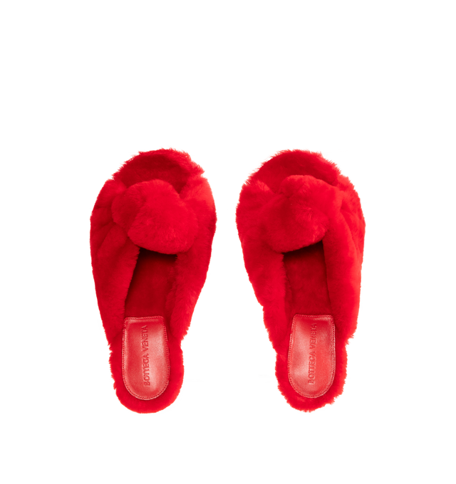 Image 5 of 5 - RED - BOTTEGA VENETA Cherry Mule featuring kitten heel mule sandal in soft merino shearling and a cushioned signature knot detail. Merino shearling. Lining: lambskin. Rubber-injected leather outsole. Made in Italy.