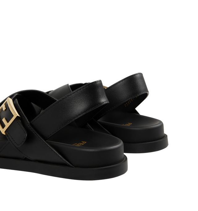 Image 3 of 4 - BLACK - FENDI Feel Sandal featuring triple-band, flat cross-over slides with FF Baguette decorative buckles, elastic detail on the back strap and gold-finish metalware. 100% calf leather. Made in Italy.