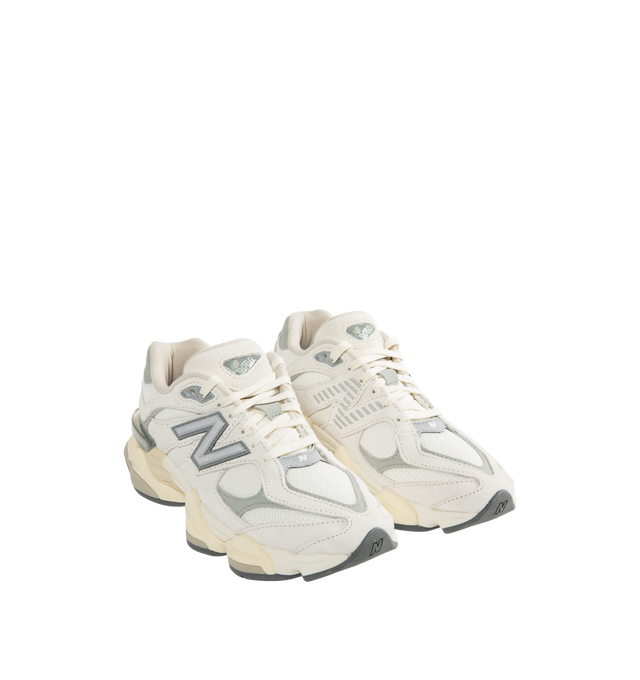 Image 2 of 5 - WHITE - New Balance 9060 Sneakers are a lace-up style with ABZORB midsole cushioning, ABZOB SBS heel cushioning, tongue logos, mesh and leather inserts, and diamond pattern outsoles.