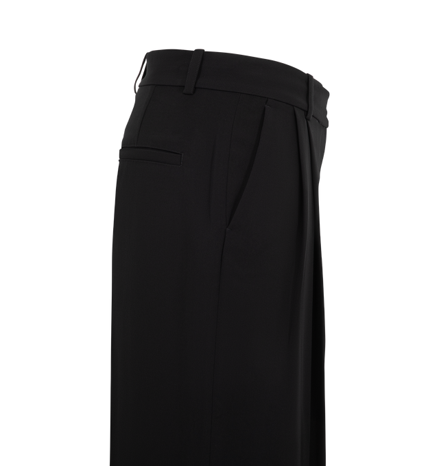 Image 3 of 3 - BLACK - Toteme Women's Double-Pleat Fluid Trousers are tailored from lightweight suiting fabric and feature a relaxed silhouette sharpened by double pleats along the front. Designed with pressed creases at the front and back, these designer trousers are finished with a zip fly, belt loops, side slant pockets, and welt back pockets for a refined approach to fluid tailoring. Main Material: 96% Viscose, 4% Polyester.