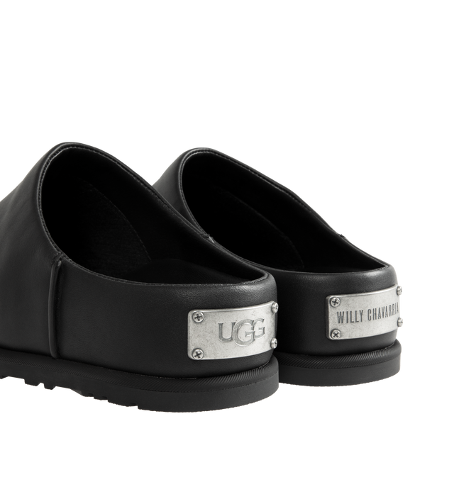 Image 3 of 4 - BLACK - UGG x Willy Chavarria Otzo Clog is crafted from premium black leather and features a slip-on silhouette for effortless everyday wear. Designed with custom Chavarria hardware logo and UGG's signature comfort-focused construction, the clog offers a refined take on casual footwear. Main Material: Leather. Unisex style in men's sizes.