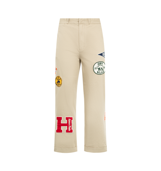 Image 1 of 4 - NEUTRAL - HUMAN MADE College Pants featuring high-density cotton chino cloth, relaxed silhouette, zip fly, brand message printed inside the back waist, bear label above one back pocket, heart button on the other, two side and back pockets and double roll-up cuff. 100% cotton. Made in Japan.