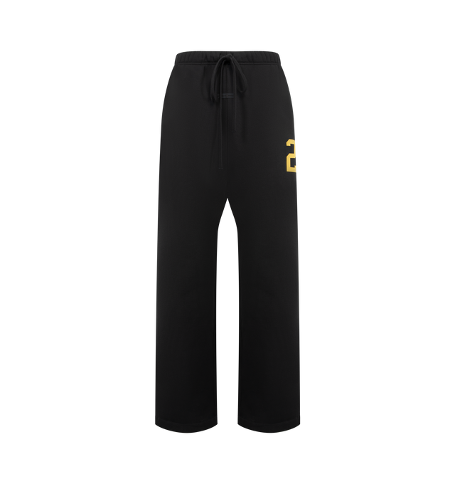 Image 1 of 3 - BLACK - FEAR OF GOD ESSENTIALS Lounge Sweatpant featuring core fleece treated with a vintage wash, wide-leg silhouette, a 26 HD print graphic on the leg, encased elastic waistband with elongated drawcords, side seam pockets and a Fear of God Essentials rubberized label stitched at the center front. 100% cotton.