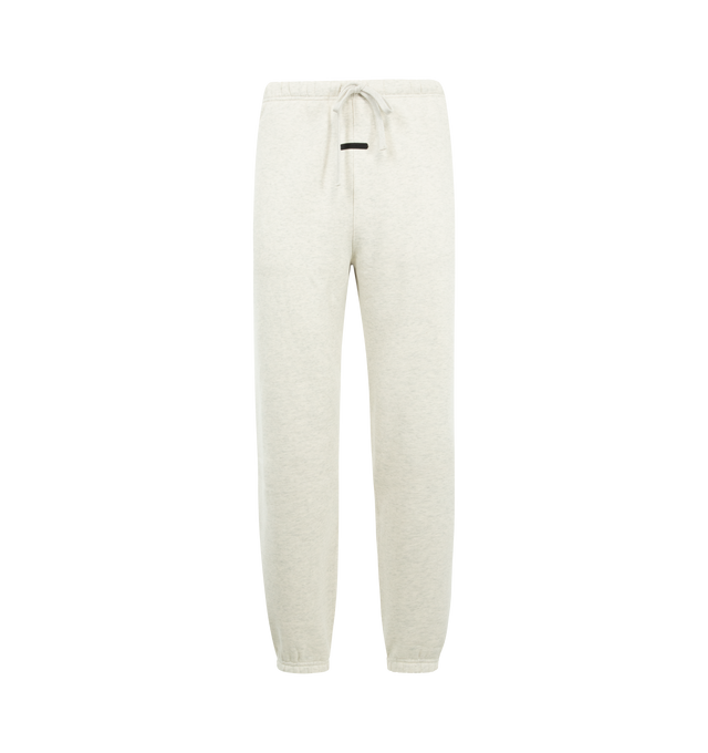 Image 1 of 3 - WHITE - FEAR OF GOD ESSENTIALS Signature Classic Sweatpant featuring 380GSM core fleece, relaxed silhouette, elastic hem, encased elastic waistband with elongated drawcords, side seam pockets, embroidered Essentials signature logo on the leg and an Essentials signature label at the center front. 80% cotton, 20% polyester.