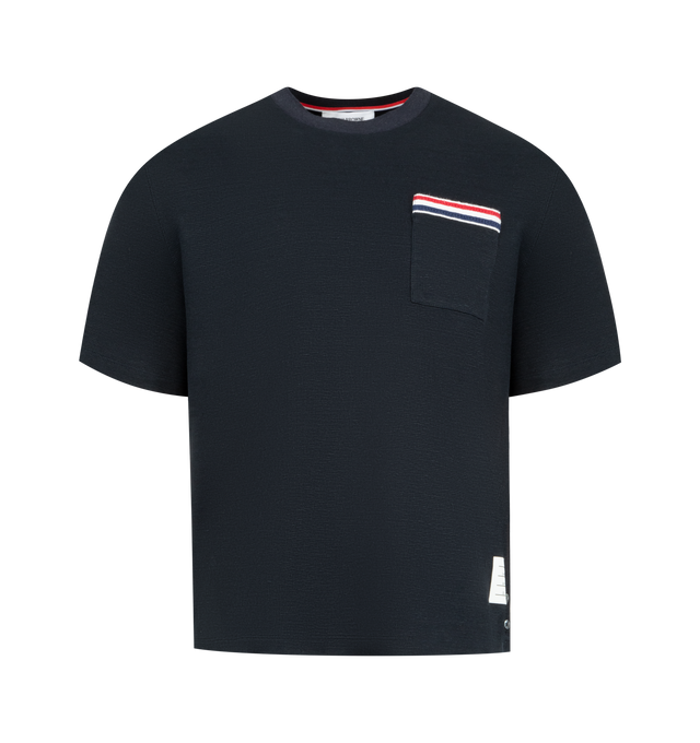 Image 1 of 3 - NAVY - THOM BROWNE Textured Cotton Linen Tee featuring a cotton-linen blend, waffled exterior, ribbed neckline, patch chest pocket with knit RWB trim, buttoned side vents with RWB grosgrain trim, stepped hem, name tag appliqu and signature striped grosgrain loop tab. 55% cotton, 36% linen, 7% polyamide, 2% elastane.
