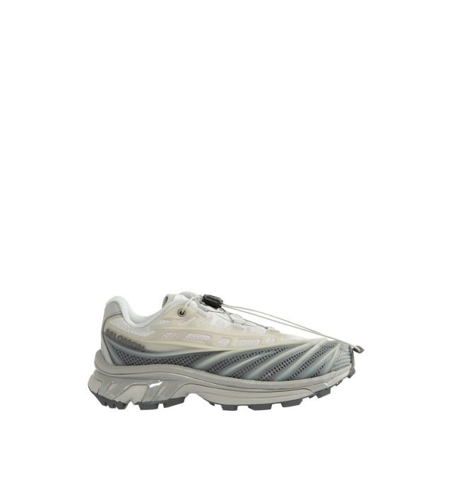 Image 1 of 5 - GREY - Salomon Unisex XT-EVO Sneakers are built with a synthetic and textile upper and are made to be a performance-driven combining stability and cushioning for lasting comfort. Additional details include Quicklace one-pull lacing, endoFit internal sleeve construction, sensiFIT support, seamless construction, and a lace pocket for streamlined wear. A molded OrthoLite sockliner and Mud ContaGRIP rubber outsole enhance cushioning, durability, and traction across varied terrain. Upper: Syntheti
