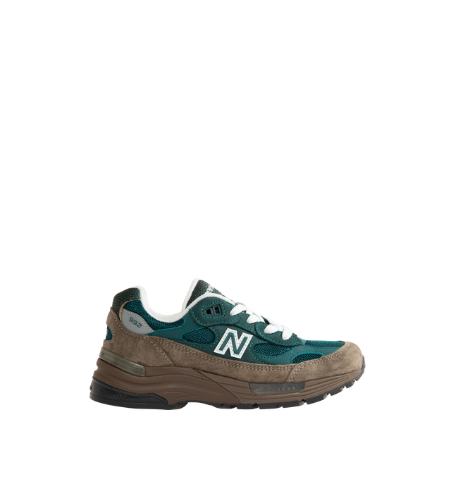 Image 1 of 5 - GREEN - New Balance Made in USA 992 Sneakers feature a timeless silhouette that blends premium craftsmanship with advanced comfort technology. A fan-favorite since its introduction, this seasonal edition showcases a tonal blue upper crafted from breathable mesh and premium suede overlays, contrasted by a black sole unit. ABZORB cushioning at the heel and forefoot provides exceptional impact absorption, while the ENCAP and C-CAP midsole combination delivers lightweight support and stability. F