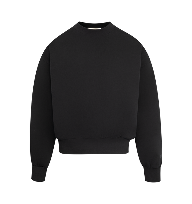 Image 1 of 2 - BLACK - FEAR OF GOD ESSENTIALS Classic Fleece Crewneck made from 380gsm core fleece featuring a classic fit with signature Fear of God relaxed proportions. A new "Essentials Fear of God" beveled metallic logo is branded across the back. Details include rib-knit collar, cuffs, and waist-hem. A "Fear of God Essentials" rubberized label is stitched on the sleeve. 80% cotton, 20% polyester fleece.