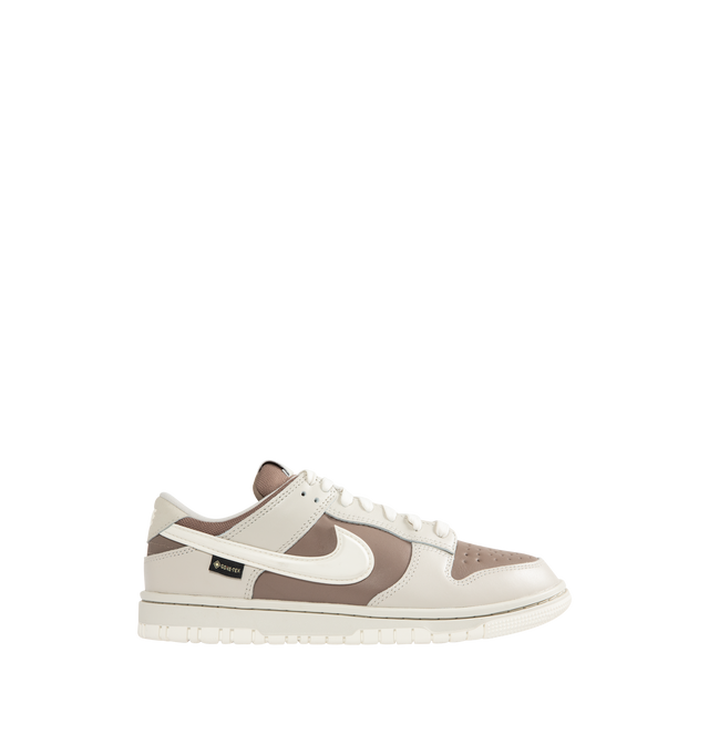 Image 1 of 5 - BROWN - NIKE Dunk Low GORE-TEX Sneaker featuring waterproof GORE-TEX finish, low-cut silhouette, reflective-design detail, padded collar, foam midsole and rubber outsole with classic pivot circle.
