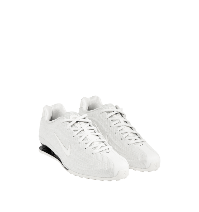 Image 2 of 5 - WHITE - NIKE Shox Z Sneaker featuring textile upper with rubber sole, lace-up front, cushioned textile footbed and lining, signature Swoosh at outer panels and modern low-profile with compressed heel columns.