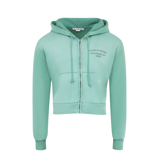 Image 1 of 2 - GREEN - ACNE Hooded Sweatshirt featuring sprayed cotton fleece, regular unisex fit, waist-length, long sleeves, zip-up front, drawcord hood, ribbed cuffs and hem, kangaroo pockets and Acne Studios 1996 logo stamp on chest. 100% cotton.