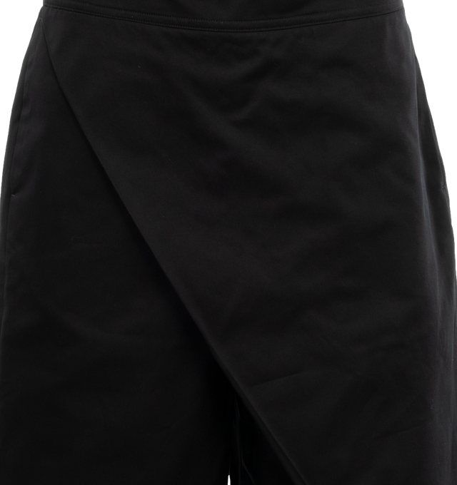 Image 4 of 5 - BLACK - Loewe Trousers crafted in lightweight cotton with a folded panel at the front. Featuring a relaxed fit, cropped length, mid waist, loose leg, partly elasticated waistband, side zip fastening, seam pockets, rear welt pocket with Anagram embossed leather tab placed on the rear pocket. Made in Italy. 
