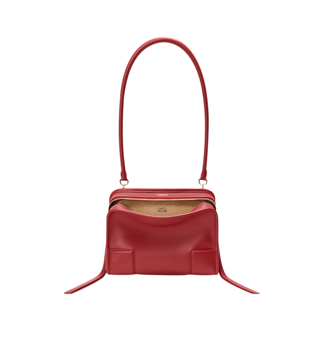 Image 9 of 18 - RED - Loewe Small Amazona 180 Bag in leather features a relaxed silhouette anchored by a single toron top handle, designed to be carried open, while a concealed closure secures the main compartment, three carry options: short handle, removable shoulder strap and crossbody, zip closure with two leather zip pullers, two compartments, main compartment closed with magnetic closure, internal flat pocket, left side d-ring for customization, nappa lambskin lining, and embossed double L branding. Le